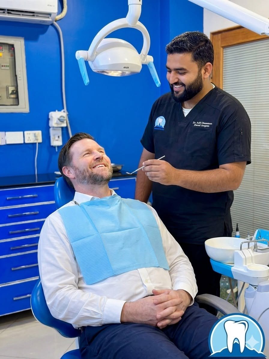 Dr. Adil Rehman Ghumman with a smiling patient at Rehman Dental Care, Burewala